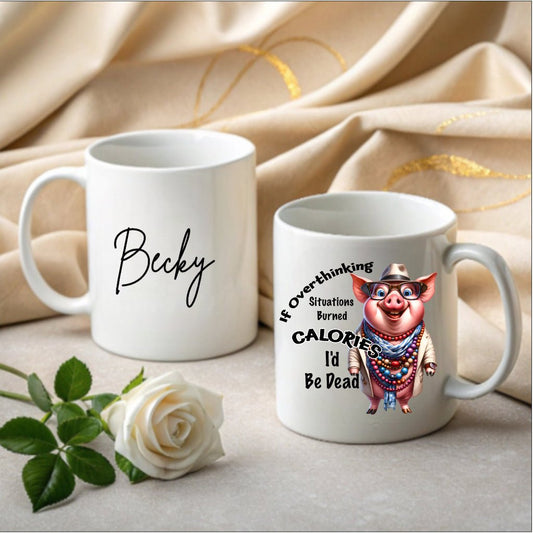 Funny ceramic mug with “If Overthinking Burned Calories I’d Be Dead” quote and playful illustration, printed in the UK