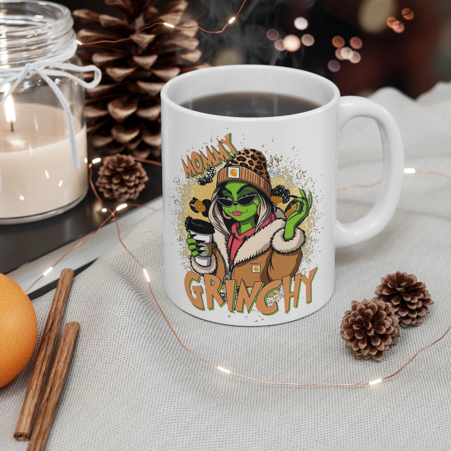 White ceramic mug with a Mommy Grinchy Christmas design, featuring festive colors and humorous holiday artwork | CB Print Concept