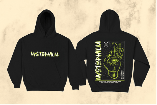 Black hoodie with 'Nyctophilia' text on front and back design on beige background