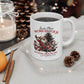 White mug featuring Santa Claus and snowmen playing instruments under a Christmas tree with the text Santa Claus World Tour.