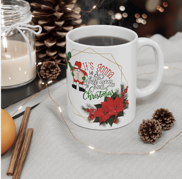 White ceramic Christmas mug with a festive gnome, poinsettias and the message "It's gonna be a full moon this Christmas 